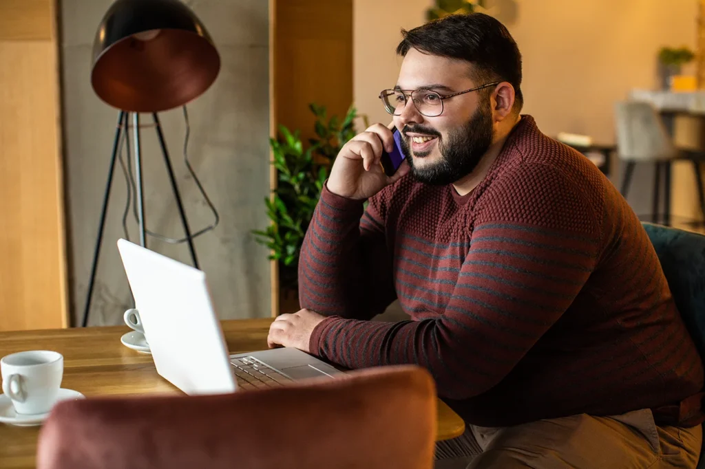 Man making a phone call, smiling