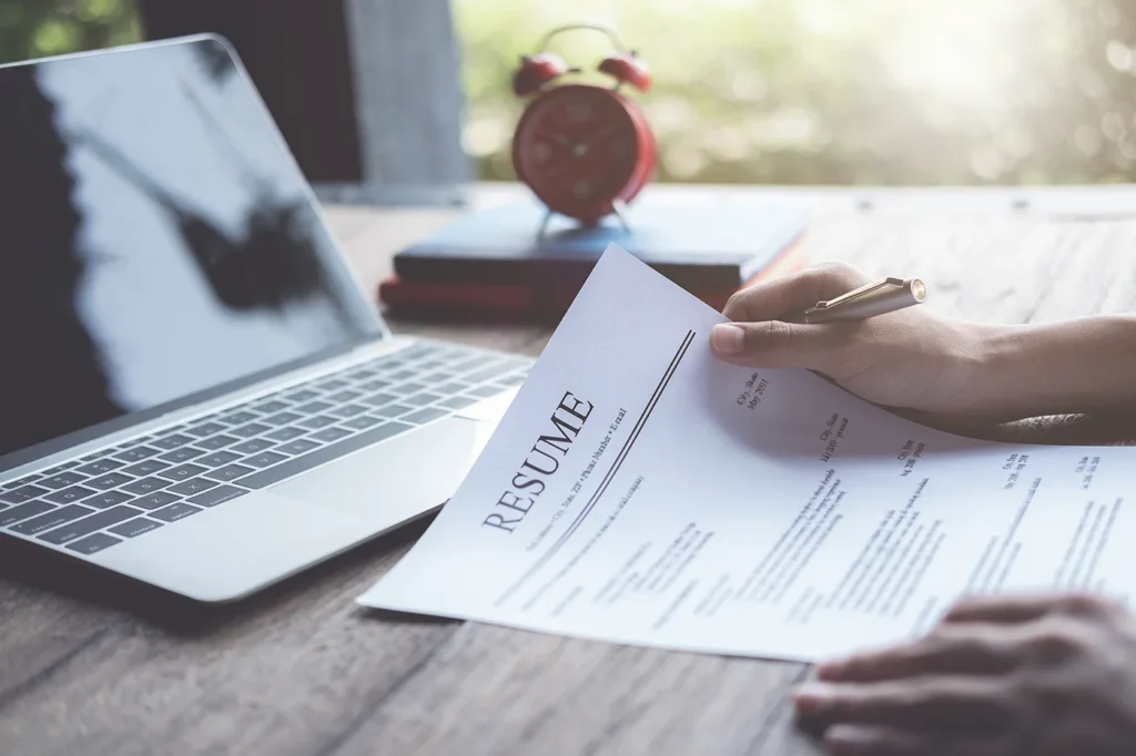 Person holding their CV
