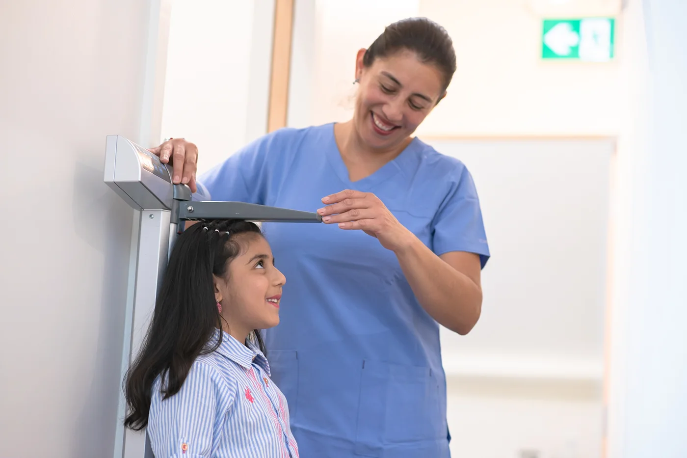 Nurse measuring child