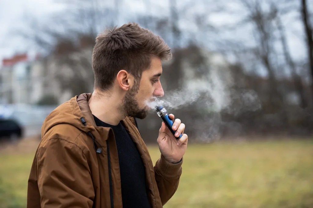 man vaping outside