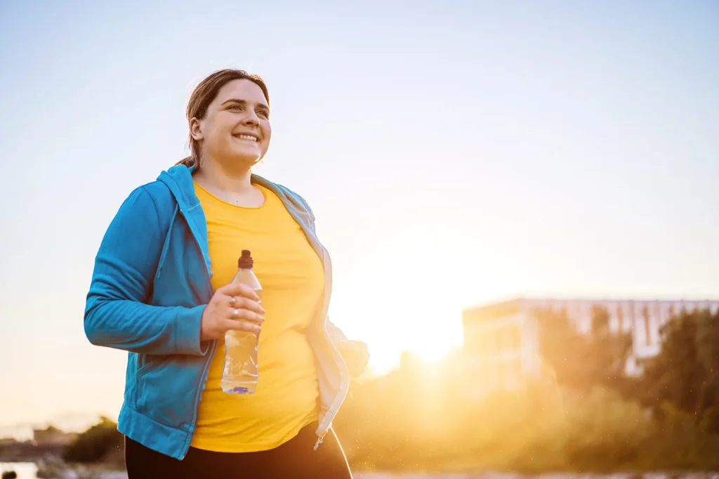 Overweight woman jogging