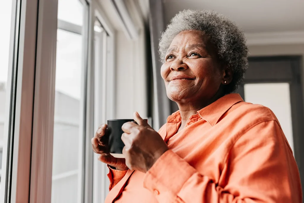 Older lady drinking cup of coffee