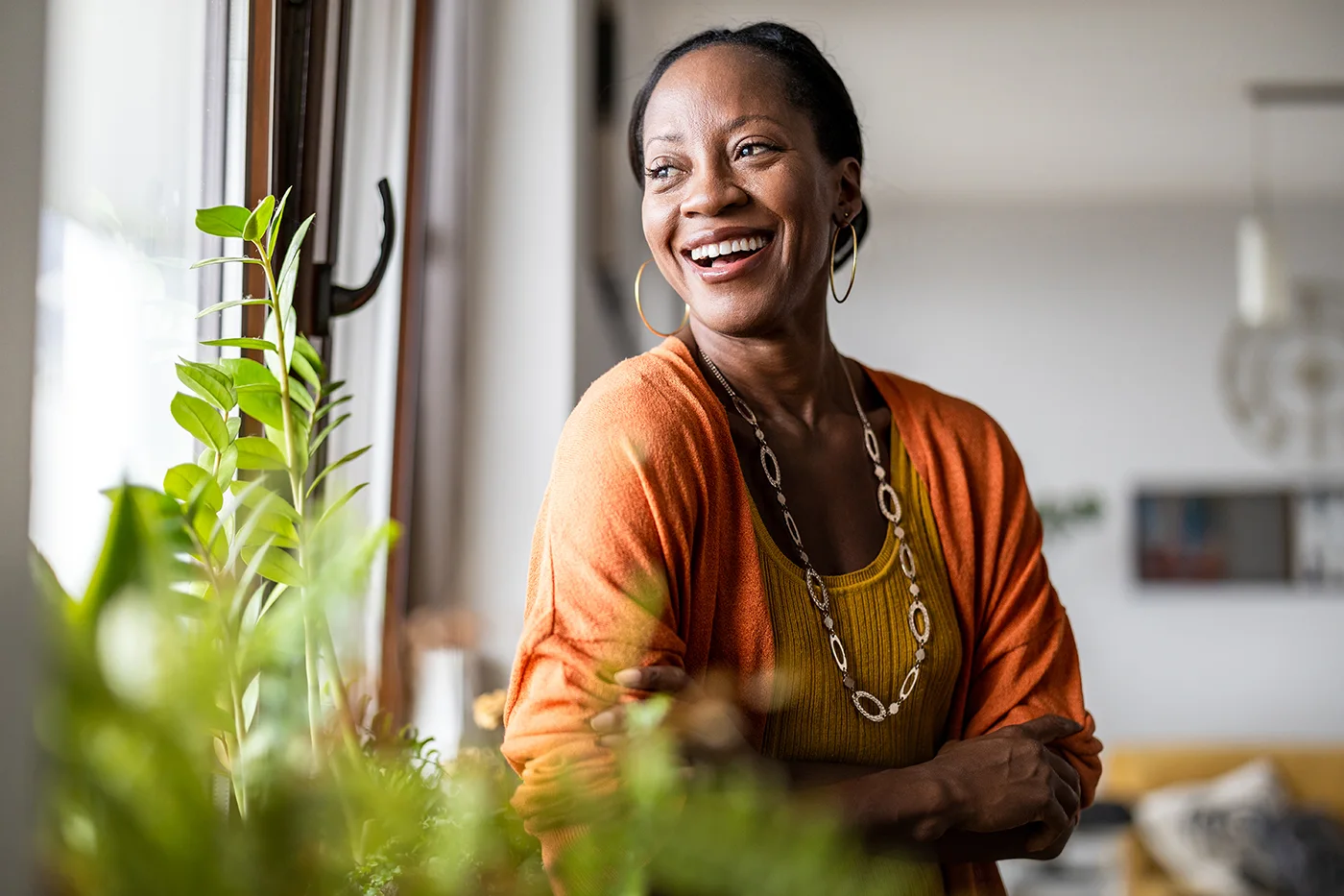 Woman smiling as she looks out of the window