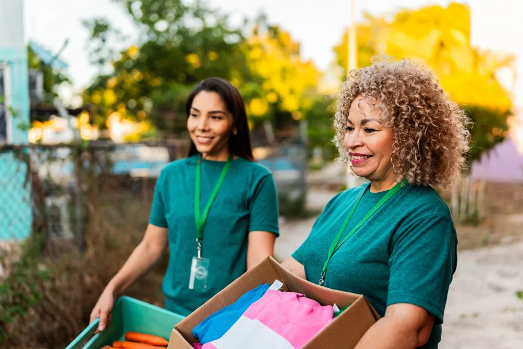 Two volunteers delivering boxes