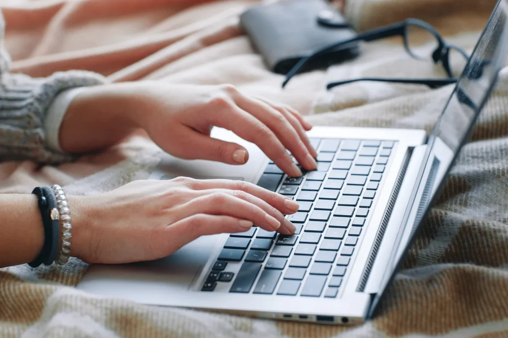 Person typing on a laptop