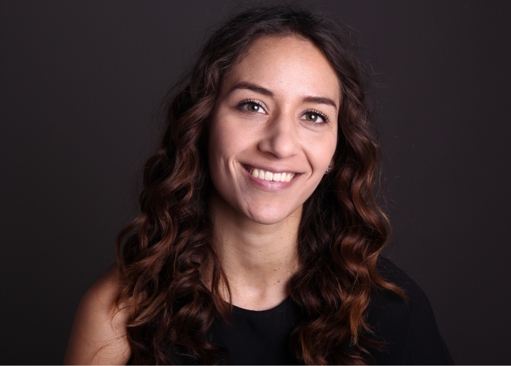 An image of a lady smiling to camera.
