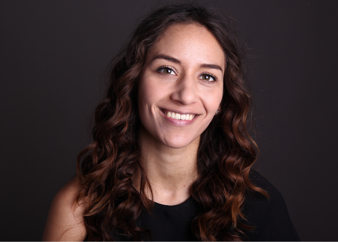 An image of a lady smiling to camera.
